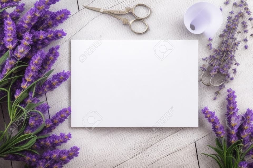 Artifical lavender flowers and blank paper Mockup. Vintage style mockup for your photos and arts. French Provence european style