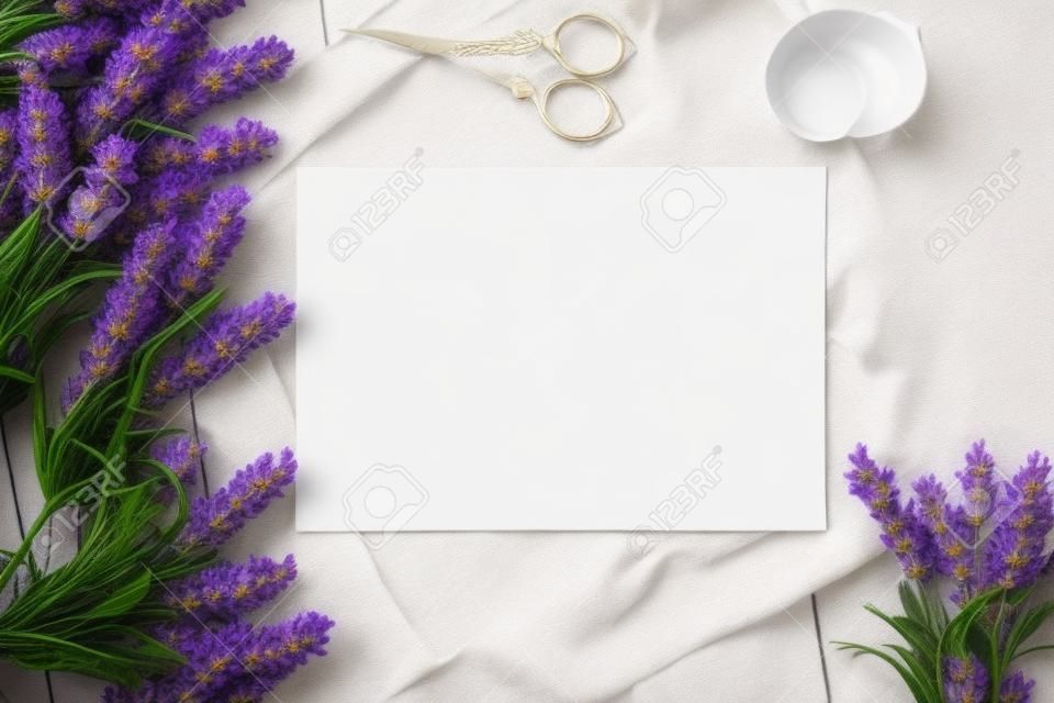 Artifical lavender flowers and blank paper Mockup. Vintage style mockup for your photos and arts. French Provence european style
