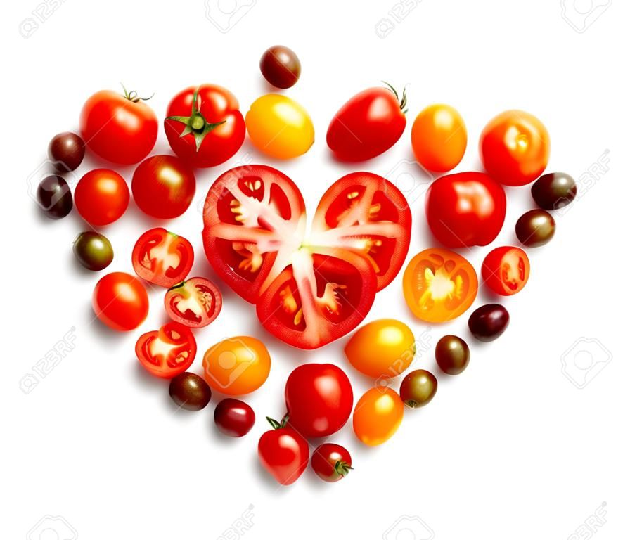 heart shape by various tomatoes isolated on white background