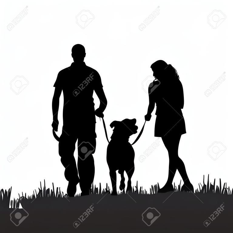 Vector Silhouette einer Familie mit einem Hund für einen Spaziergang.