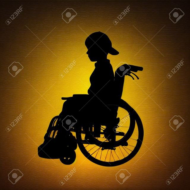 휠체어에 소년의 실루엣입니다.