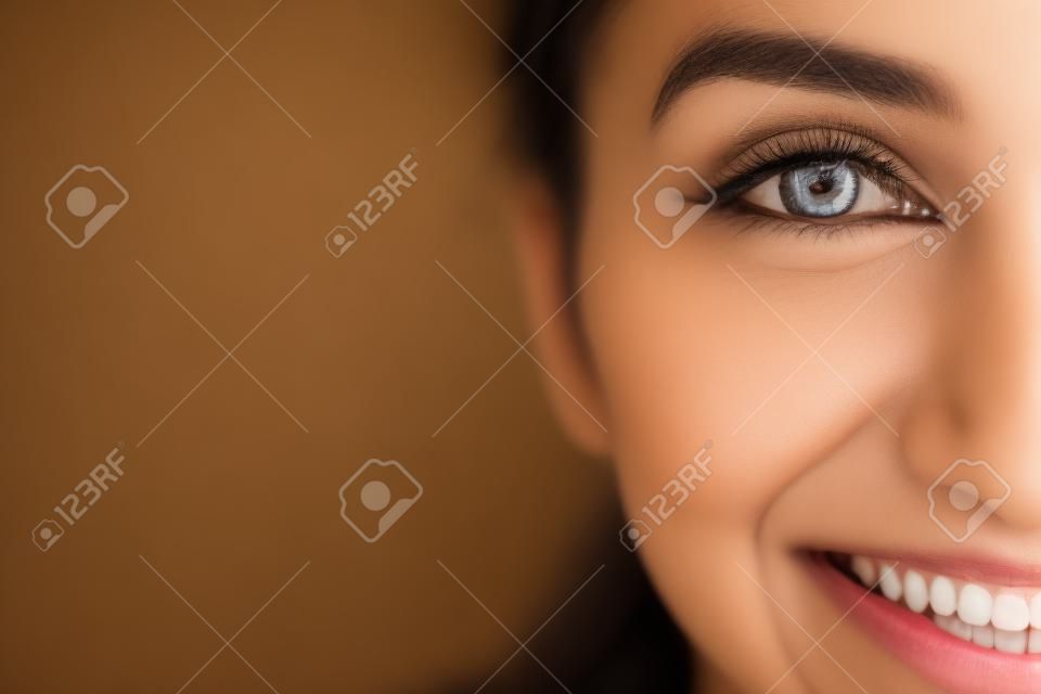 Headshot of happy young Indian woman. Close-up of cheerful diligent student. Positive girl looking at camera. Womens portrait concept