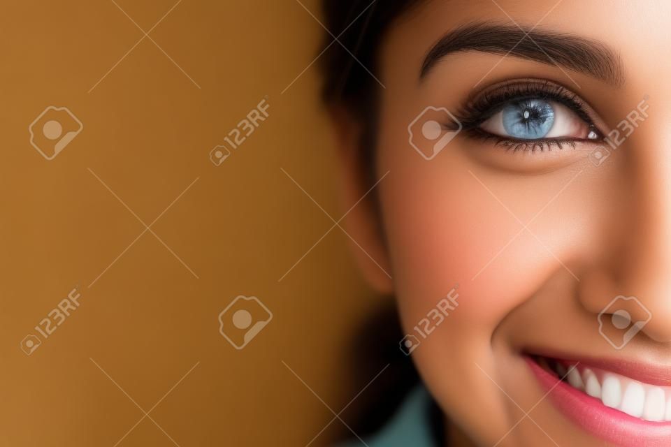Headshot of happy young Indian woman. Close-up of cheerful diligent student. Positive girl looking at camera. Womens portrait concept