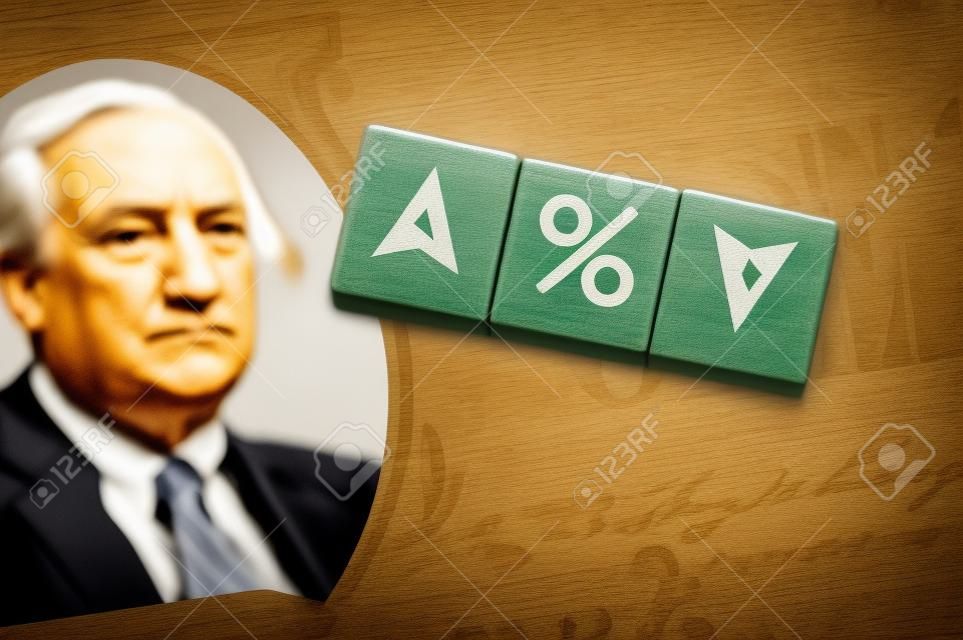 Concept idea of FED, federal reserve system is the central banking system of the united states of america and change interest rates. Percentage icon and arrow symbol on wooden cube