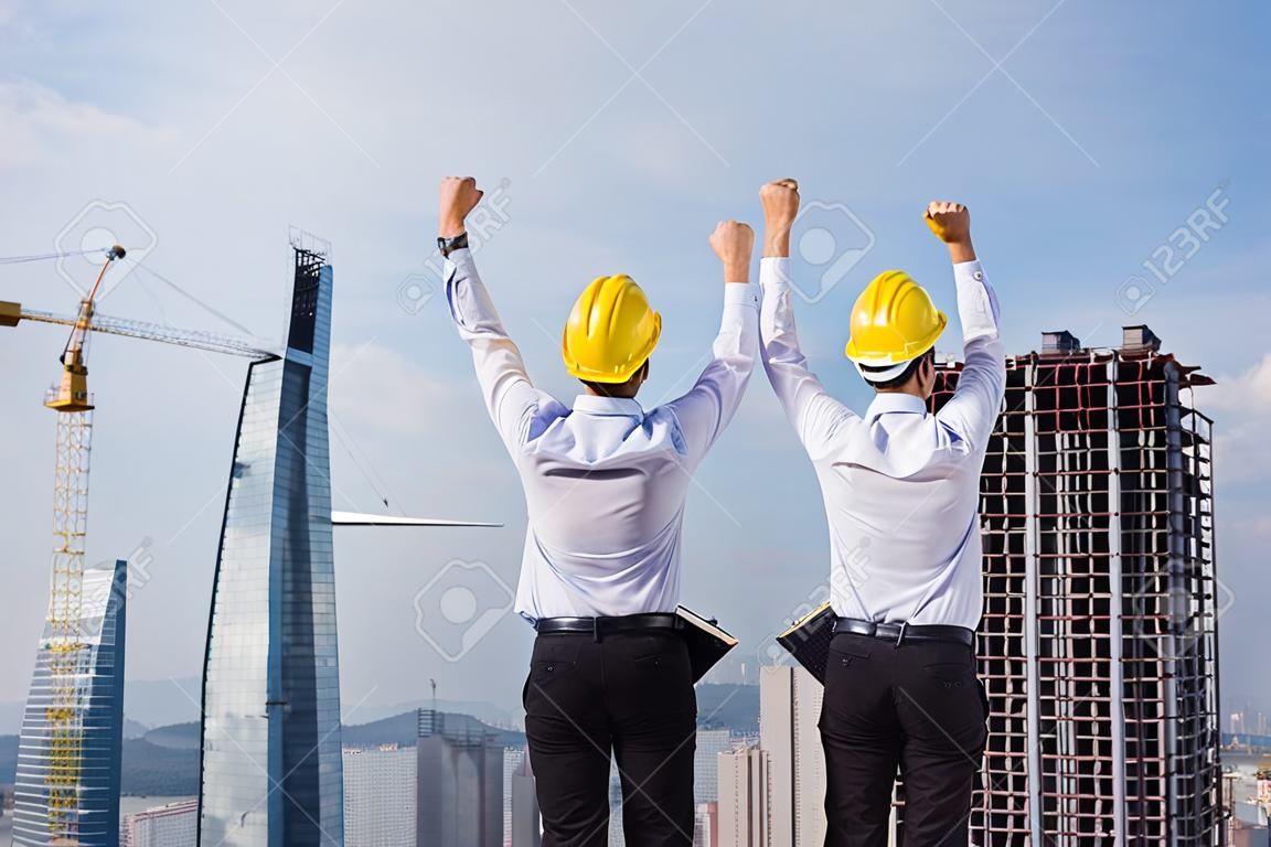 Engineer hands up in construction site