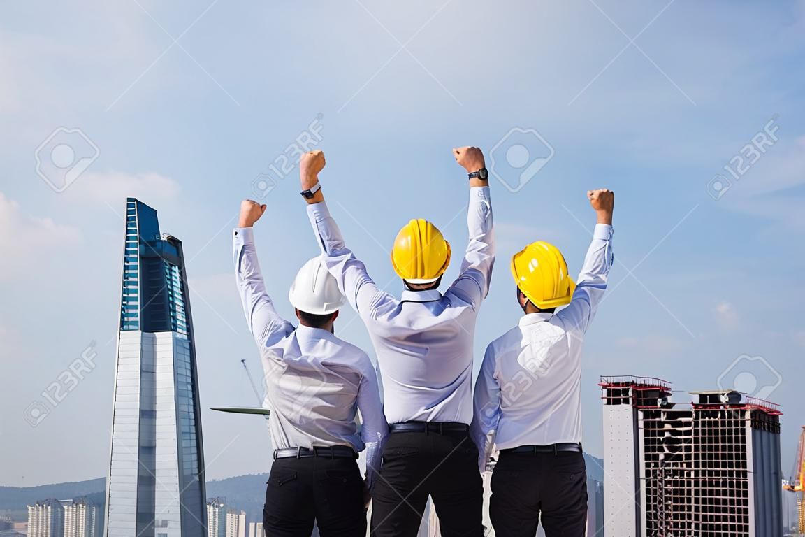 Engineer hands up in construction site