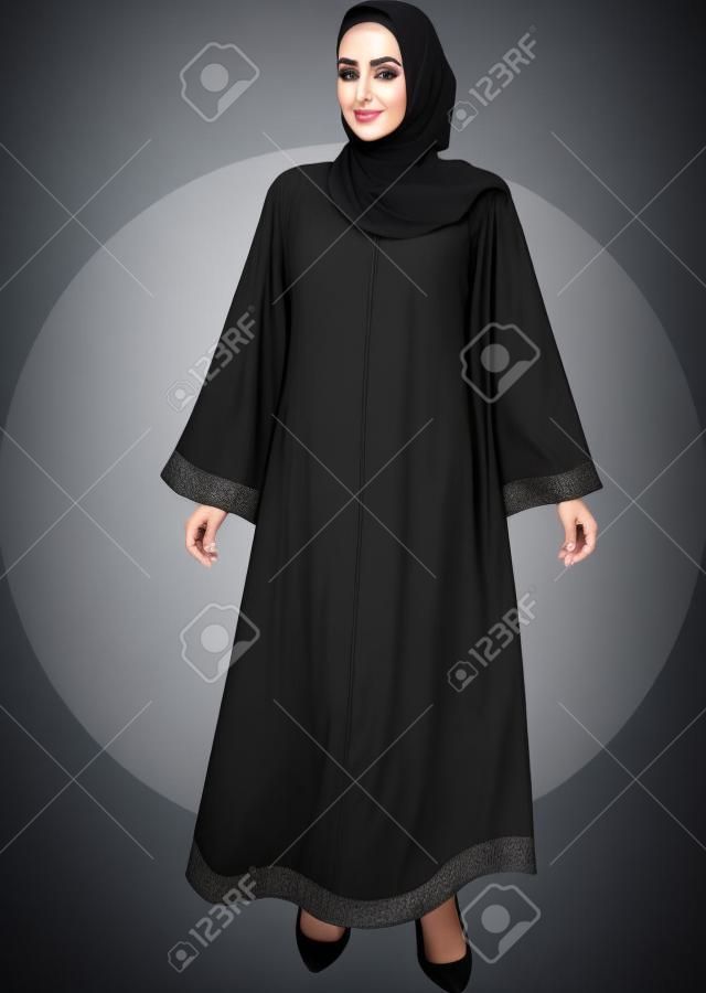 Giovane donna musulmana araba degli Emirati nella bellissima abaya nera e hijab degli emirati arabi uniti, il miglior modello islamico senza volto degli Emirati Arabi Uniti o dell'Arabia Saudita