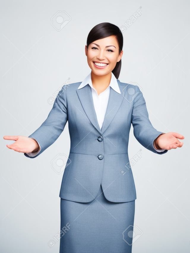 welcome gesture business woman smiling friendly and welcoming isolated on white background. Beautiful mixed race asian caucasian businesswoman model.