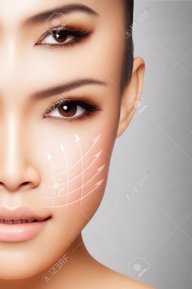 Face lift anti-aging kezelés - ázsiai nő portré grafikus vonalak mutatják arc lifting hat a bőrre.