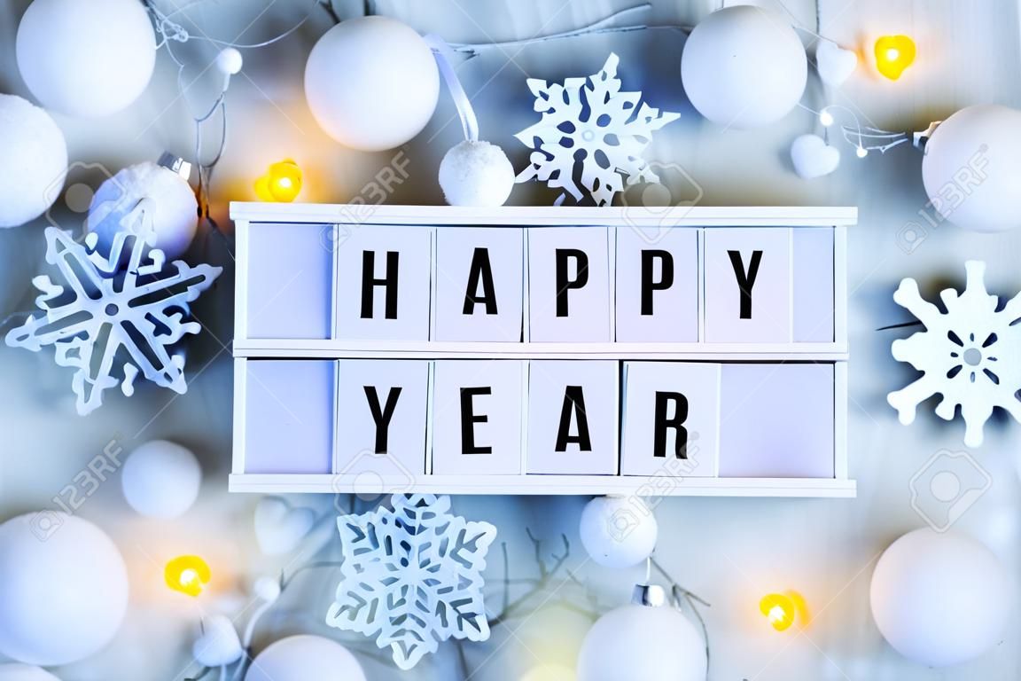 Happy New Year background. Creative layout made of greeting letters " Happy New Year" with winter decoration. Flat lay.