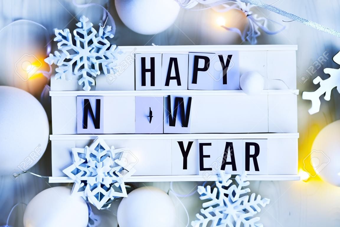 Happy New Year background. Creative layout made of greeting letters " Happy New Year" with winter decoration. Flat lay.