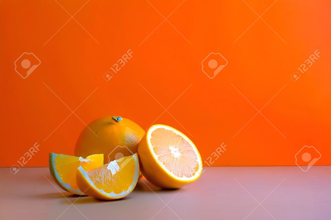 A front view of citrus in orange color background