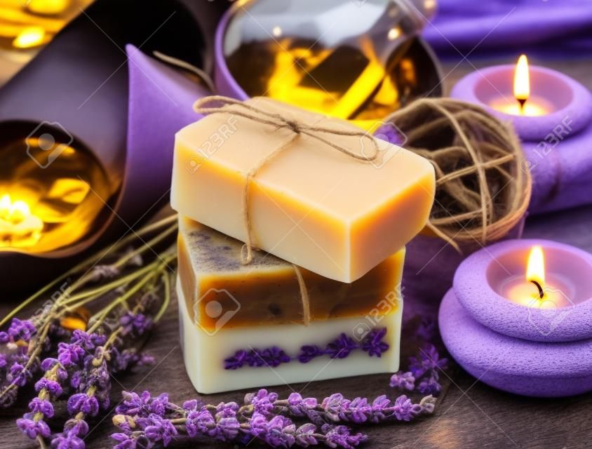 Spa Setting.Homemade Natural Soaps with Coffee, Honey and Lavander, Burning Candles