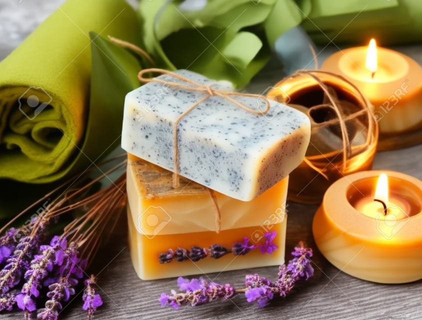 Spa Setting.Homemade Natural Soaps with Coffee, Honey and Lavander, Burning Candles