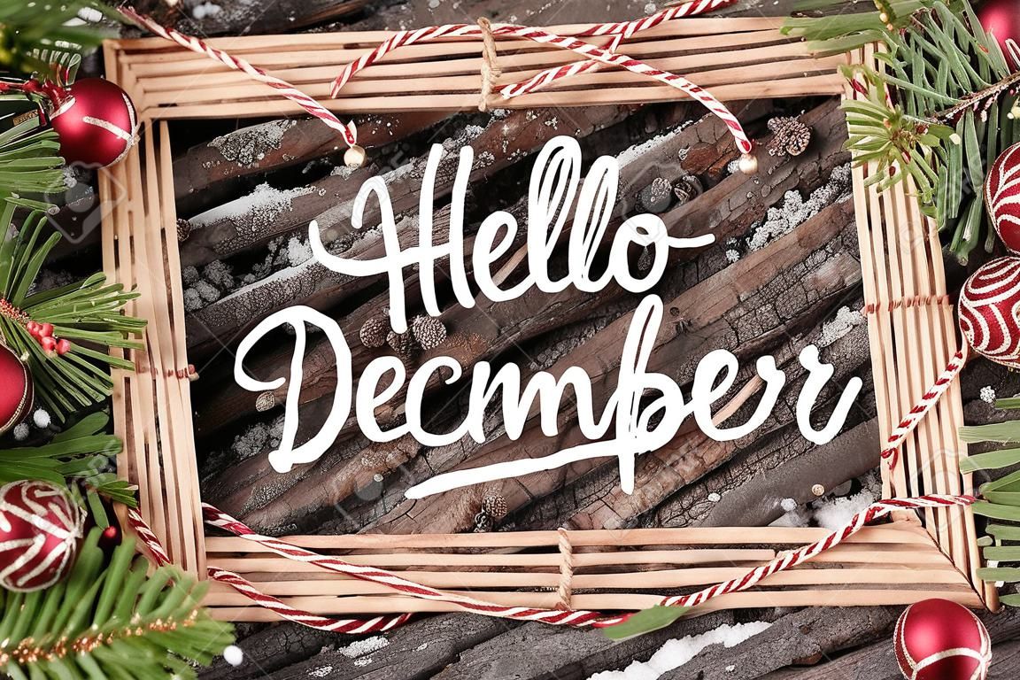HELLO DECEMBER handwritten inscription. Winter holiday composition. New Year and Christmas celebration. Winter holidays concept. Christmas decorations. Top View.