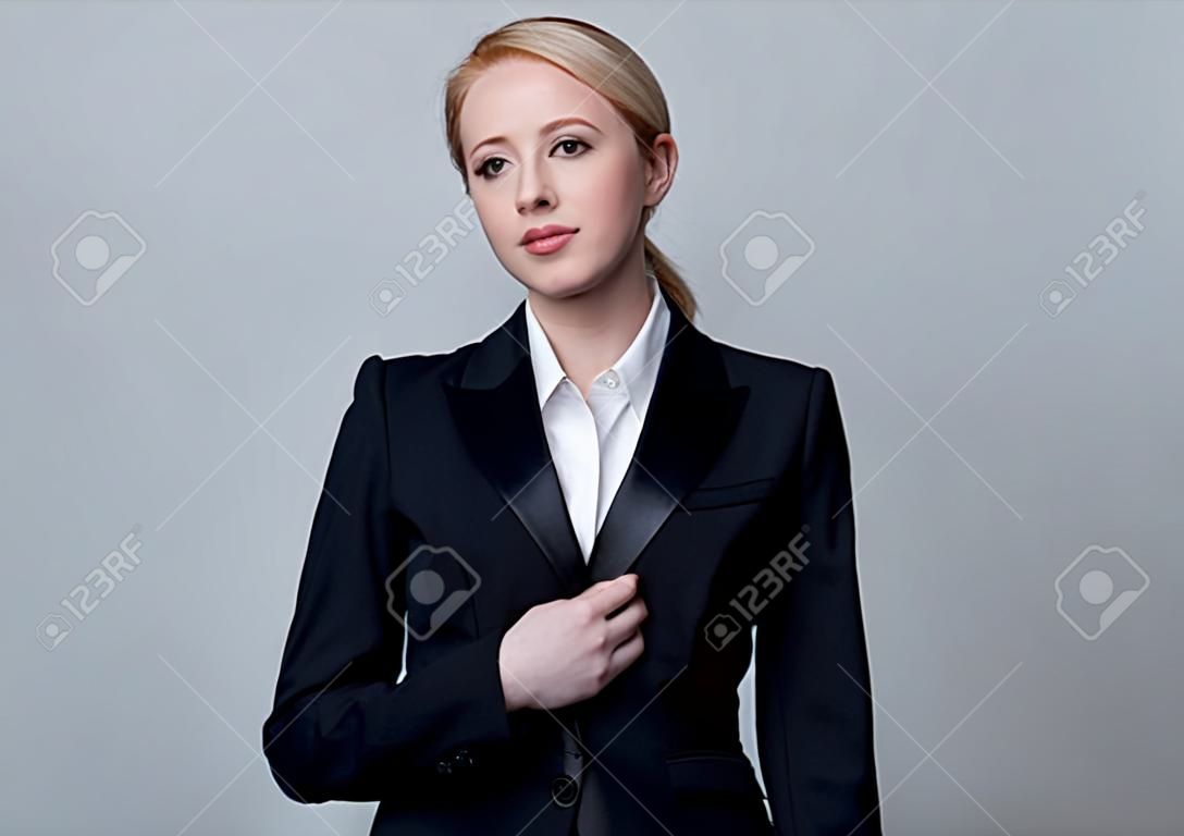 Style businesswoman in a classic black business suit