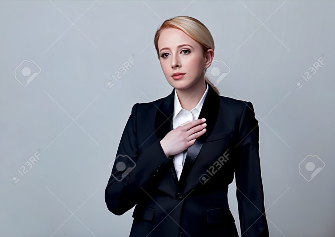 Style businesswoman in a classic black business suit