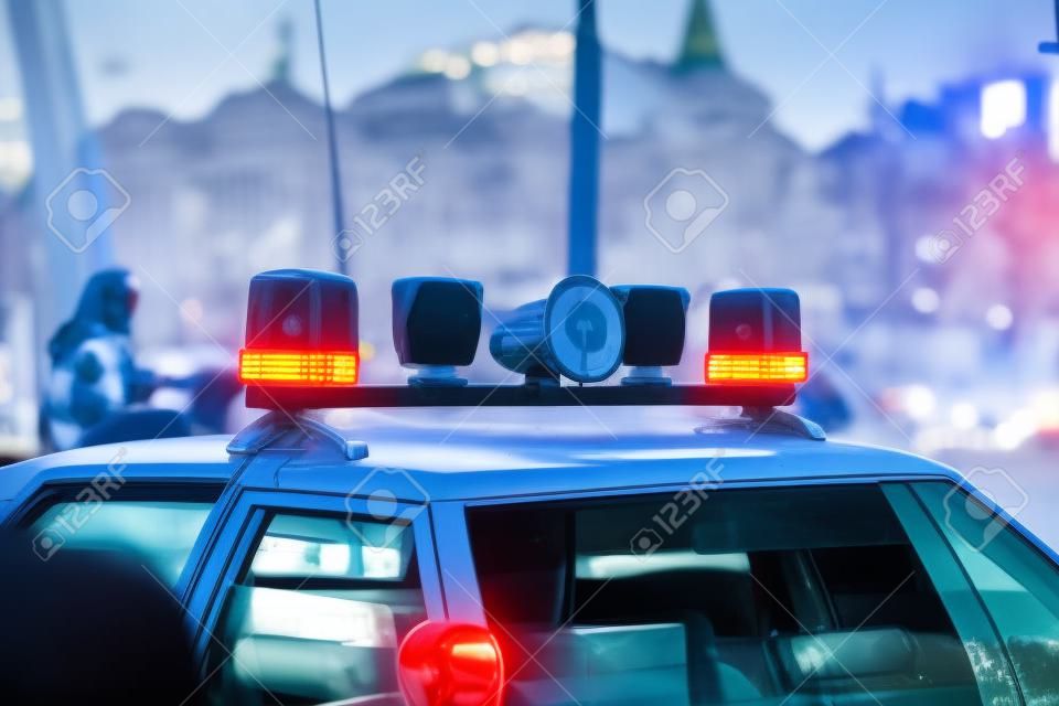 empty Police car at day lights flashing in Moscow