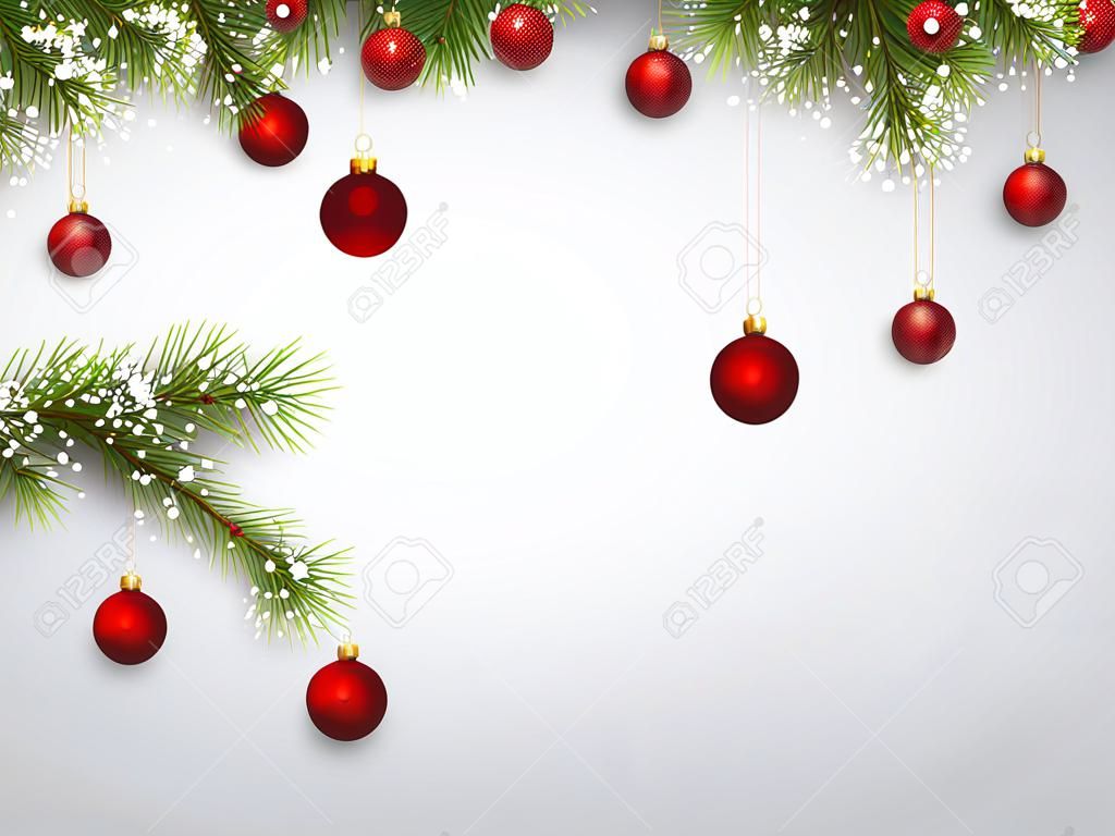 クリスマスのモミの枝と赤いボールの背景。