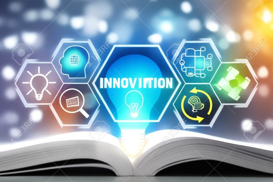 Innovation concept,  Light bulb on book with innovation icon on virtual screen.