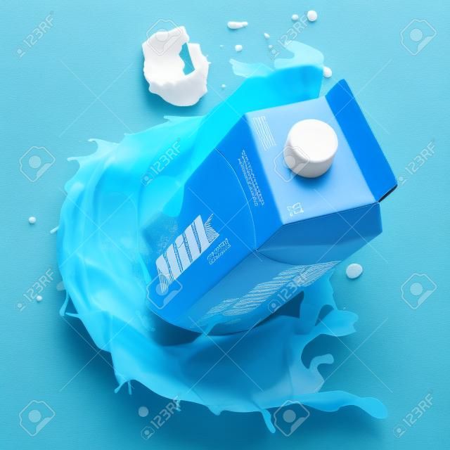 Boîte en carton de lait ou emballage de lait et éclaboussures de lait sur bleu