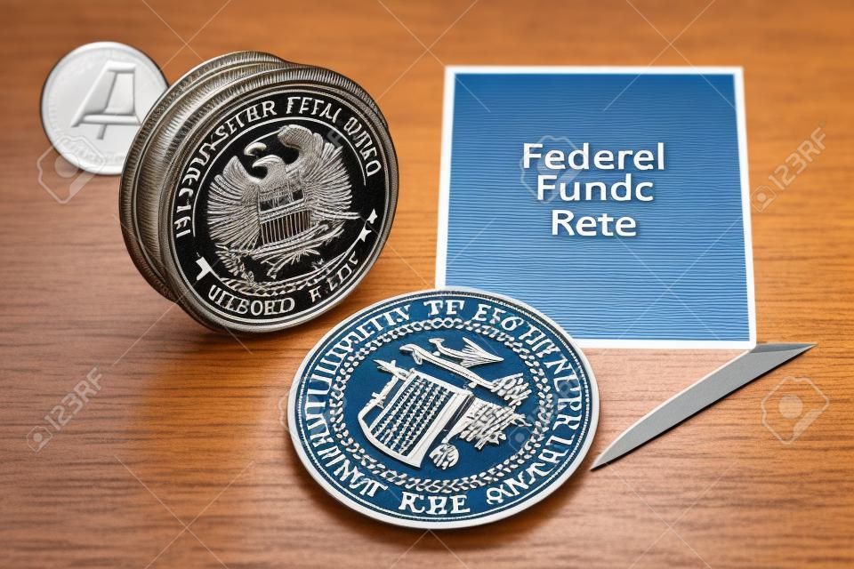 Federal funds rate decrease. Arrow with cut of federal fund rate and stamp of federal reserve FRS symbol