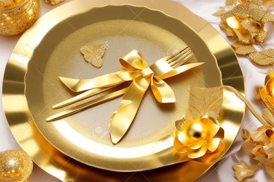 Beautiful and elegant gold place setting for christmas or celebrations