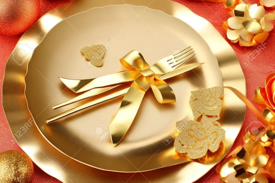 Beautiful and elegant gold place setting for christmas or celebrations
