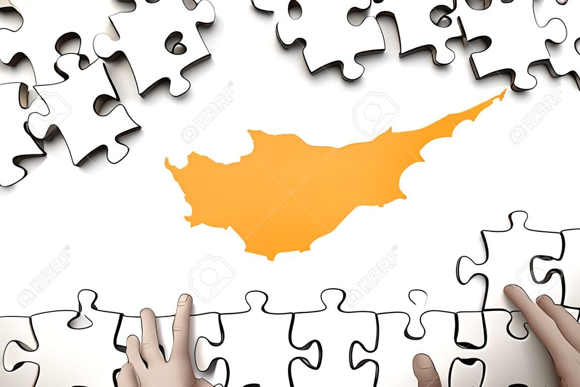 Cyprus flag  is depicted on a table on which the human hand folds a puzzle of white color.