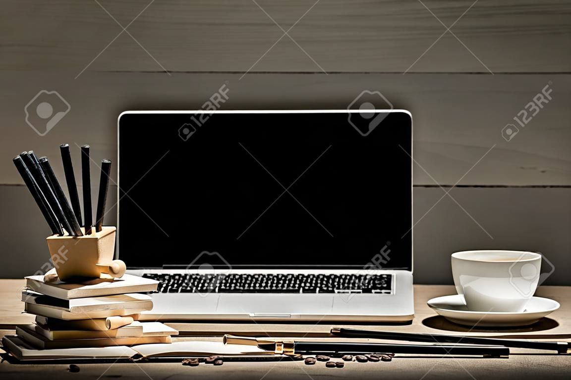 The front view of notebook and cup of coffee. Inspiration and mock-up concept