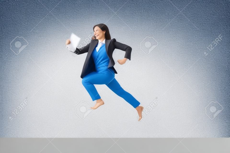 Happy business woman dancing and smiling in motion isolated over white studio background. Human emotions concept. The businesswoman, office, success, professional, , happiness, expression concepts
