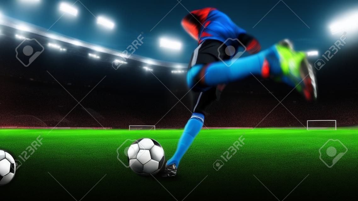 懐中電灯、勝利のゴールのためのキックボール、広角でスタジアムで活動しているプロのサッカー選手またはサッカー選手。スポーツ、競争、運動、克服の概念。フィールドプレゼンス効果。
