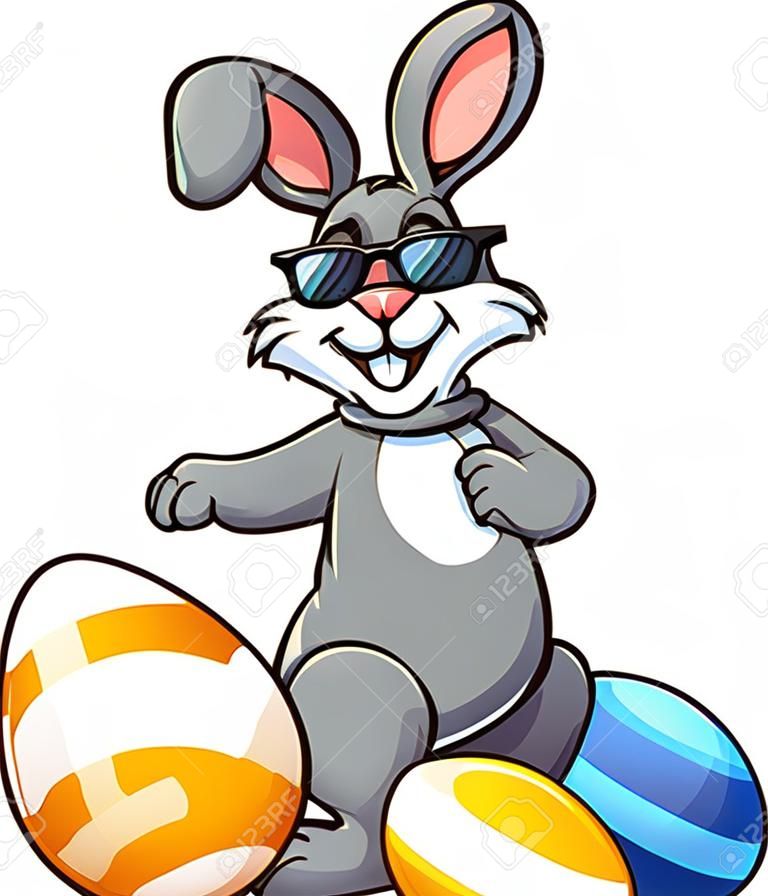 Cool conejito de Pascua con gafas de sol y de pie entre los huevos de Pascua. Ilustración de imágenes prediseñadas vectoriales con gradientes simples. Algunos elementos en capas separadas.