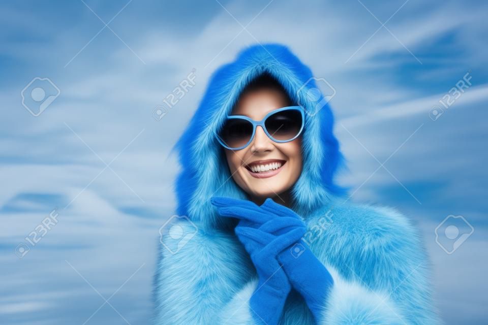 Happy woman in a blue fur