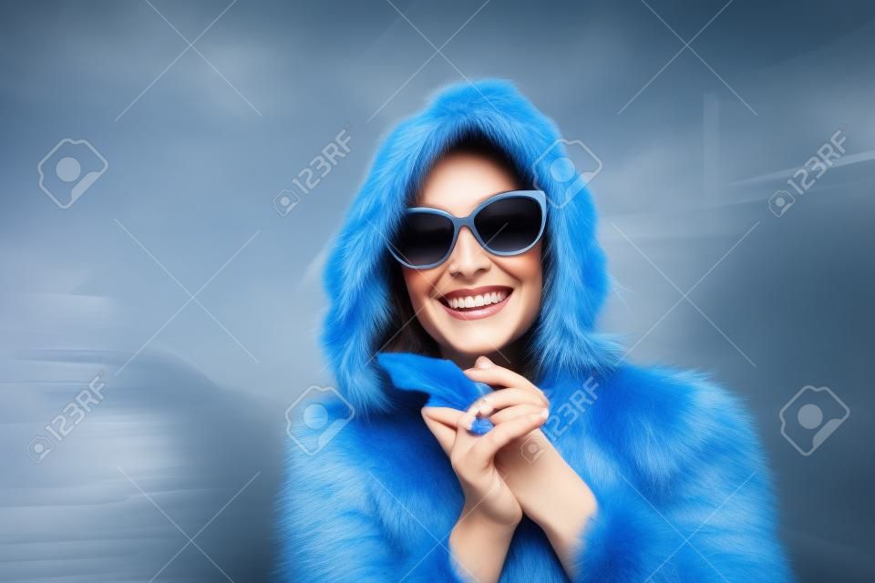 Happy woman in a blue fur