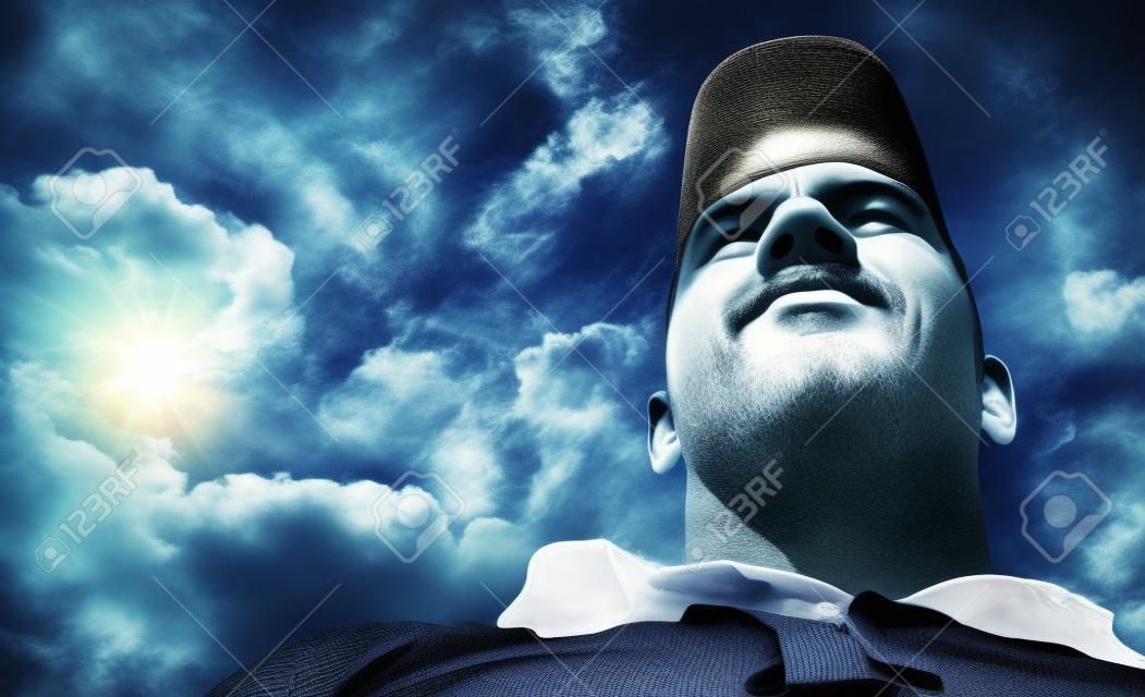 The man on the sky background - view from below