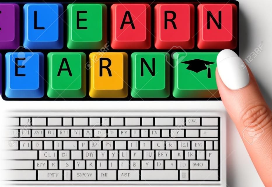 LEARN to EARN keys on a Computer Keyboard spell the value of Education and Graduation to grads earning income.