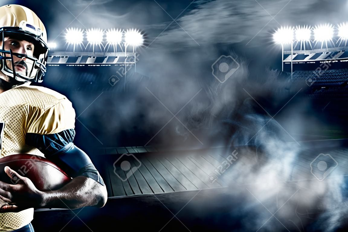 Jugador de deportista de fútbol americano en el estadio con luces en el fondo con espacio de copia