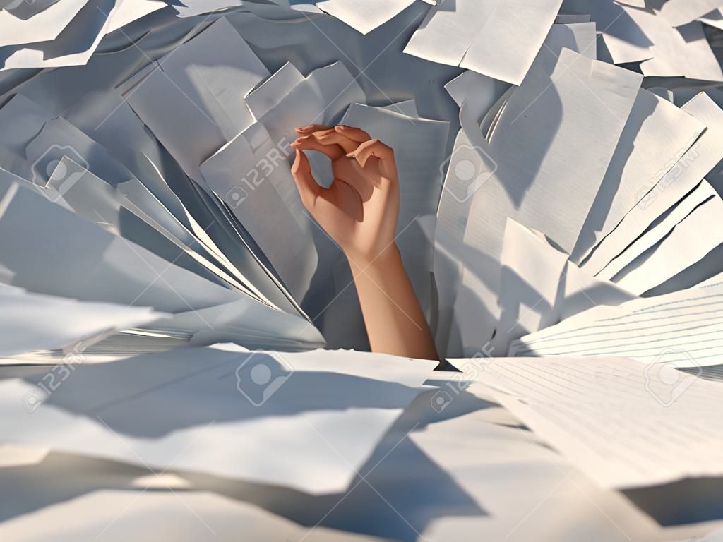 hand drowning in paper sheets