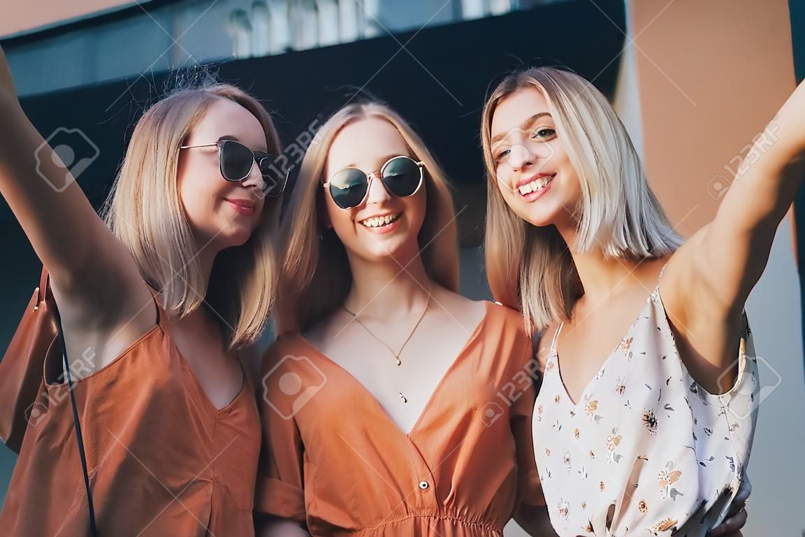 three beautiful young girls on vacation in a dress and glasses. Generative AI.