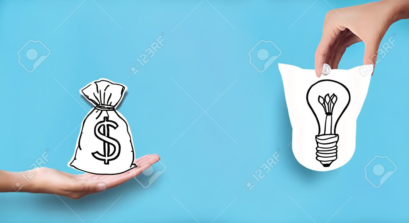 Startup supporting. Hands with dollar sign bag and light bulb over blue background, investor giving creator money
