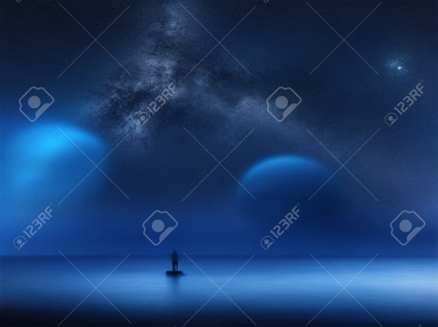 Surreal sea at night landscape with starry sky. Dromerige look.