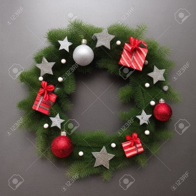Christmas wreath decorated with balls, stars and presents