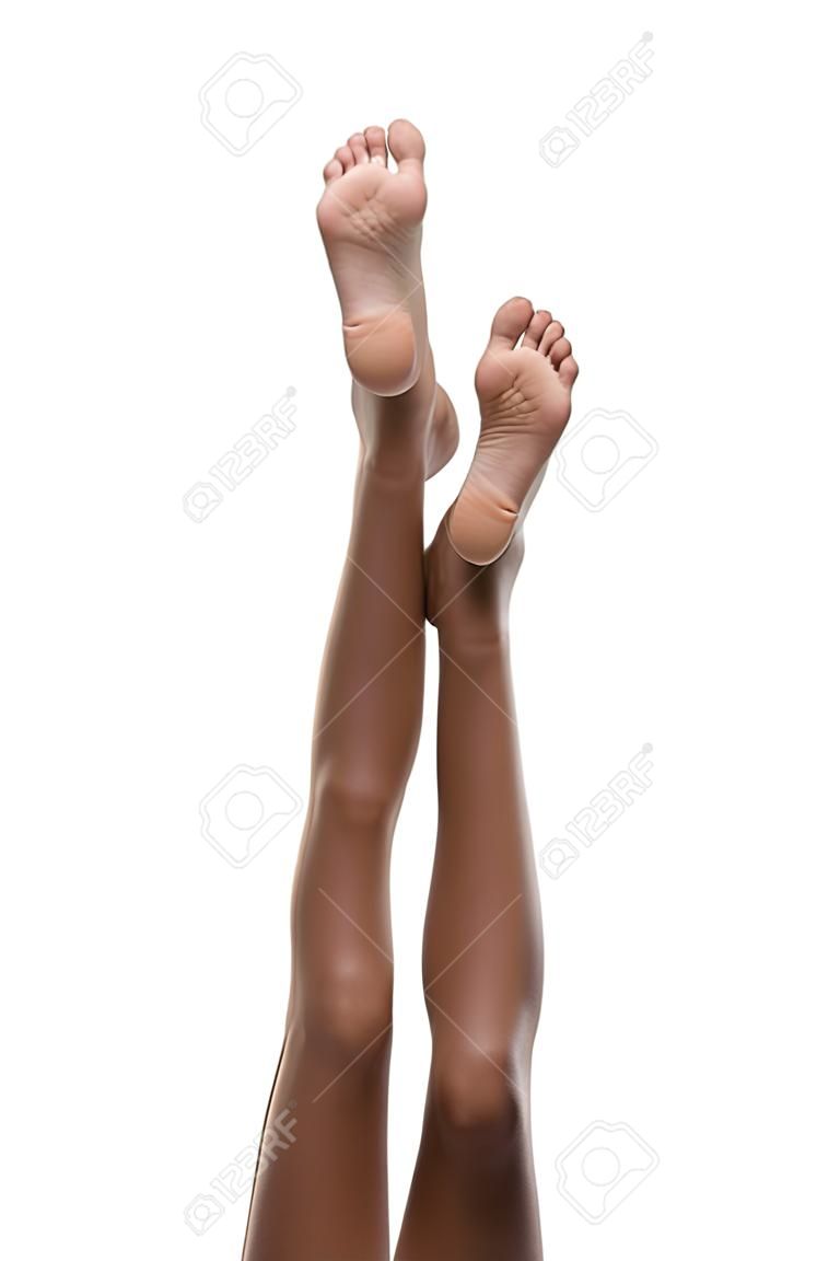 Beautiful slim legs and feet of ethnic black Afro-American female