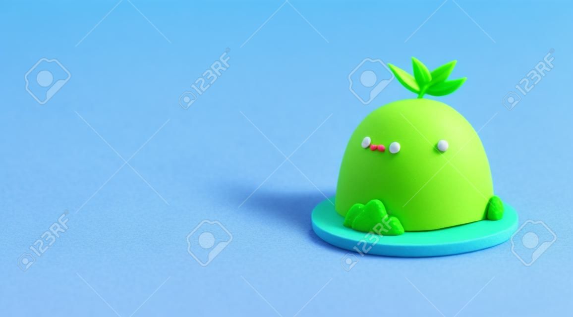 funny 3d cartoon kawaii island with a little green tree, smiling, made of plasticine, purple background, soft pop style