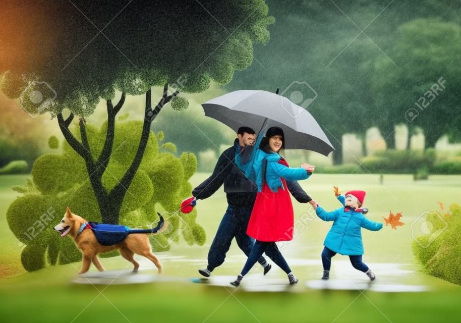 Happy young family spend joyful time together. Parent character walk in rainy weather in autumn park. Father leads a dog on a leash, mom holds hand of a daughter, she carefree jumps through puddles.