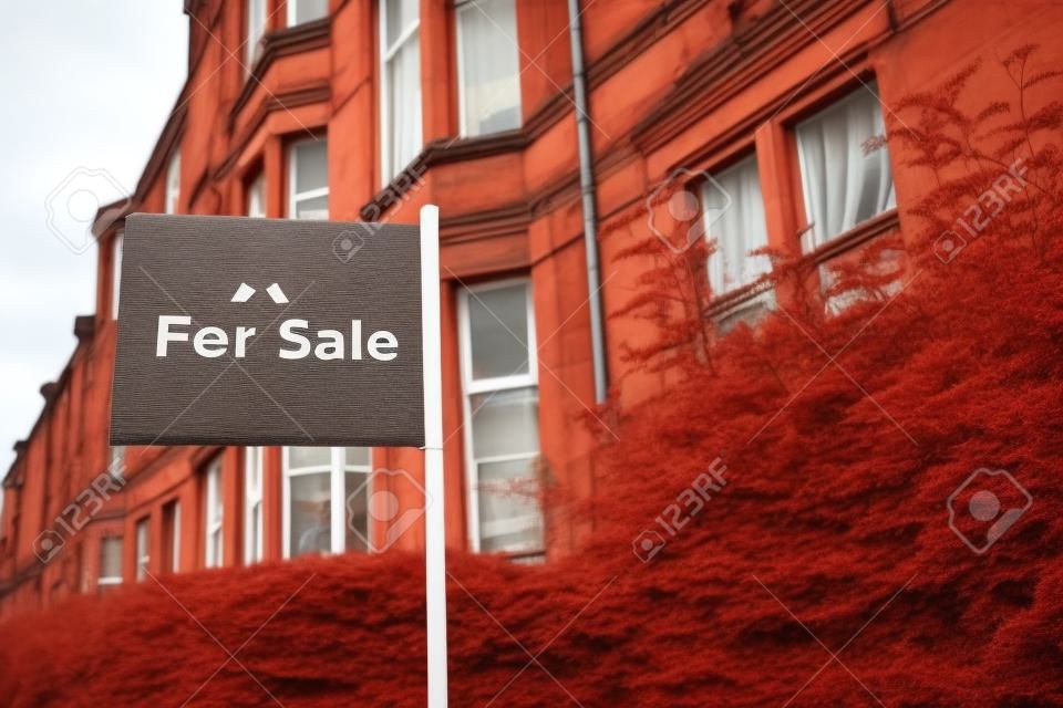 A For Sale Sign Outside A Traditional Red Sandstone Tenement Flat (Apartment) In Glasgow