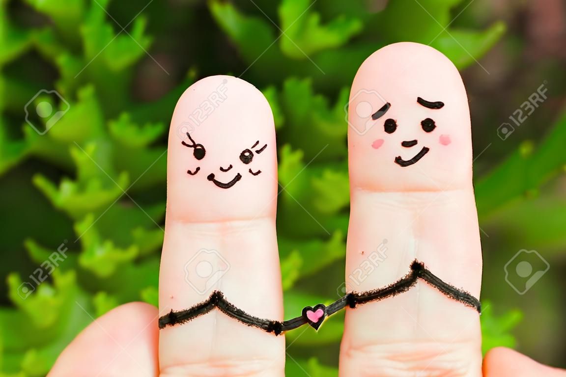 Finger-Technik eines glücklichen Paares. Glückliches Paar Händchen haltend.