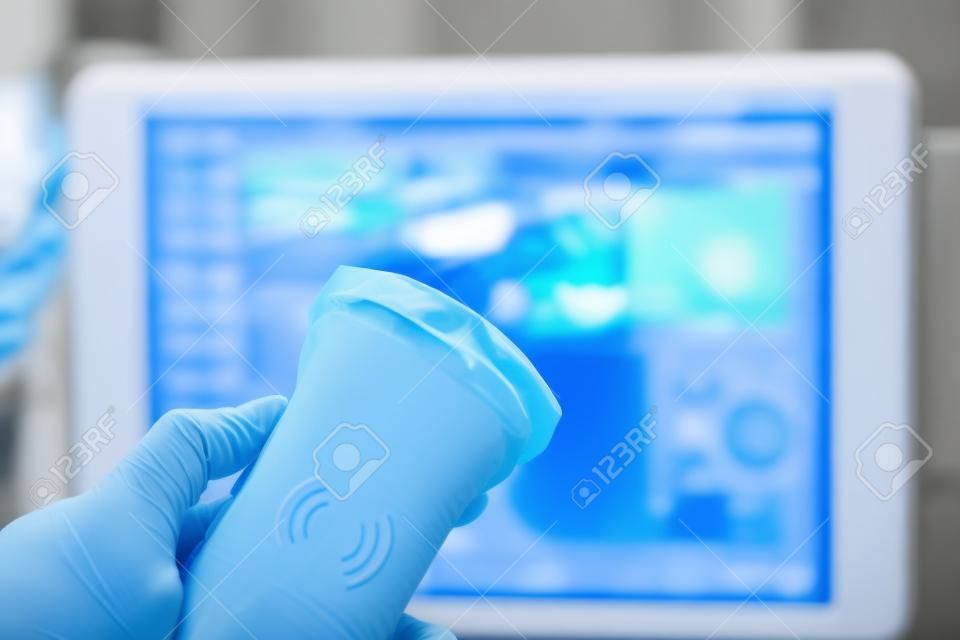 Modern portable ultrasound machine in clinic laboratory of sonography diagnostics.