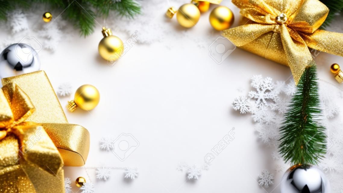 Christmas frame. Winter wooden decoration background. Xmas board with old rustic wall, white frozen snow, golden balls and gift box. New year with copy space